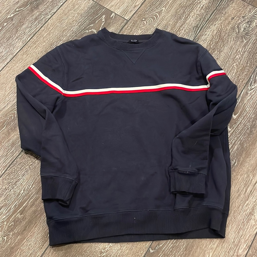 Navy blue crewneck sweatshirt with a blue, white and red stripe